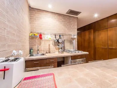 a large kitchen with a sink and a stove at Apartment Augustus by Interhome in Rome