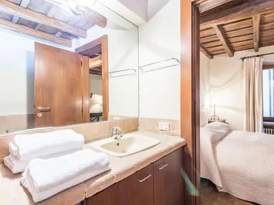 a bathroom with a sink and a bed at Apartment Augustus by Interhome in Rome