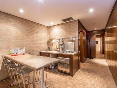 a kitchen with a counter and a table in it at Apartment Augustus by Interhome in Rome