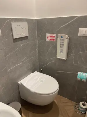 a bathroom with a white toilet in a room at La casa di Jonathan al Ghetto in Rome