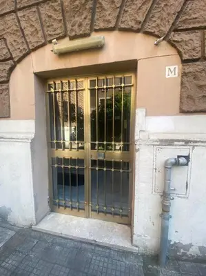 a door with a metal gate on a building at Domus Viola in San Giovanni in Rome