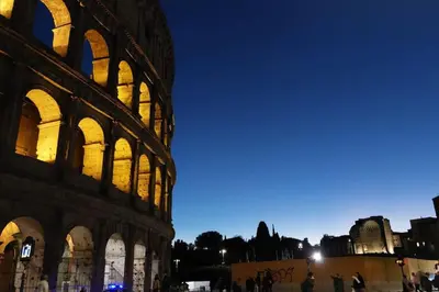 a view of the colosseum at night at Loft Colosseo, in Rome Center in Rome
