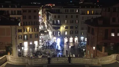 a view of a city at night with buildings at Loft Colosseo, in Rome Center in Rome