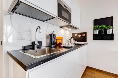 a kitchen with a sink and a counter top at Roma in relax lovely two room in the center of Rome, Fabrizia in Rome