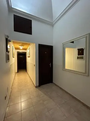 a hallway with a door and a mirror on a wall at Alloggio Turistico in Rome