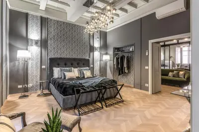 a bedroom with a large bed and a dressing room at White Miracle Suite in Rome