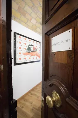 a door with a picture of a car on the wall at Chroma Italy - Chroma Octho in Rome