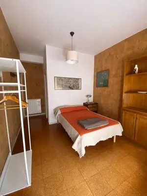 a bedroom with a bed with a red blanket at Joyful Home in Rome