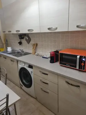 a kitchen with a microwave and a sink at Ad un passo dal Vaticano in Rome
