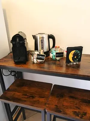 a table with a coffee maker and a tea kettle at Casa Aurelia in Rome