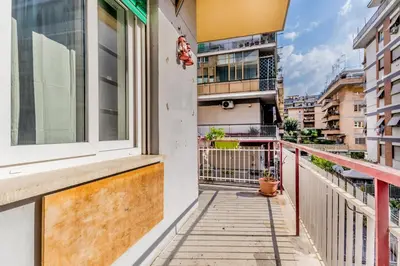 a balcony of a building with a window at BBHOME Tiburtina Station apartment in Rome
