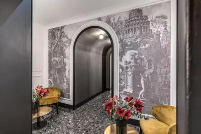 a hallway with a large painting on the wall at Residenza Piranesi Boutique Hotel in Rome