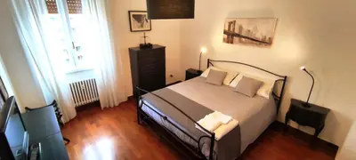 a bedroom with a bed and a window at appartamento panoramico su Roma in Rome