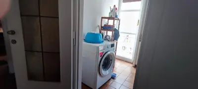 a washing machine with a blue top in a room at appartamento panoramico su Roma in Rome