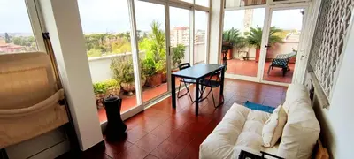 a living room with a couch and a table at appartamento panoramico su Roma in Rome