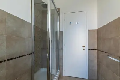 a shower with a glass door in a bathroom at GuestHost - Tra Castel Sant'Angelo e Città del Vaticano Flat in Rome