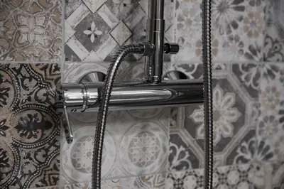 a shower hose is hooked up to a wall at Domus Coriolano in Rome