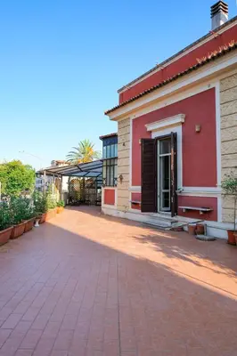 a brick driveway in front of a building at Domus Lilium in Rome