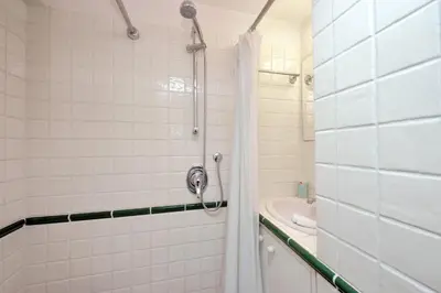 a bathroom with a shower and a tub at Beautiful Apartment in Campo de Fiori in Rome