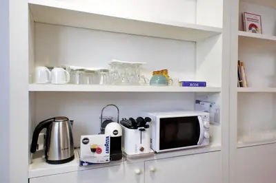 a kitchen with a microwave and a coffee maker at Beautiful Apartment in Campo de Fiori in Rome