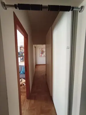 a hallway with an open door to a room at Casa Bambù in Rome