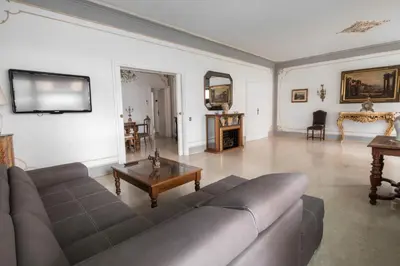 a living room with a couch and a table at The Majestic Residence in Vatican in Rome