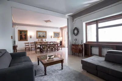 a living room with a couch and a table at The Majestic Residence in Vatican in Rome