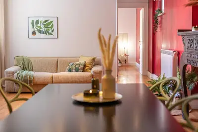 a living room with a table and a couch at Oasis Rome Centre Apartment in Rome