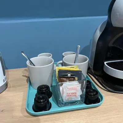 a tray with some food and cups on a table at Ele Suites Pantheon in Rome