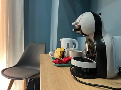 a coffee maker sitting on top of a table at Ele Suites Pantheon in Rome