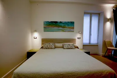 a bedroom with a large bed in a room at Colosseum Maison in Rome