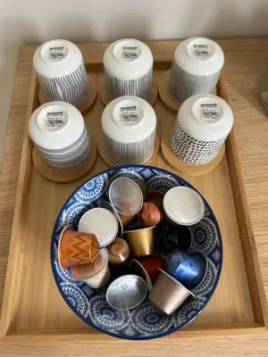 a wooden tray with a plate of differentiatesiatesiatesiatesiatesiatesiatesiates at Colosseum Maison in Rome