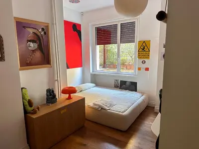 a small bedroom with a bed and a window at Appartamento con terrazza centrale e luminoso in Rome