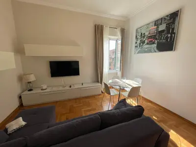 a living room with a couch and a table at A due passi da San Pietro in Rome