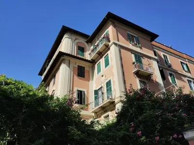 a large building with balconies and a blue sky at La Dimora Torlonia Elegance & light in Rome in Rome
