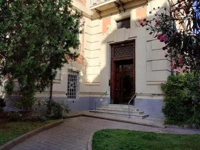 a building with a door and stairs and a yard at La Dimora Torlonia Elegance & light in Rome in Rome