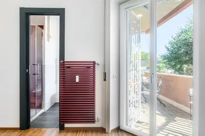 a sliding glass door leading to a patio at Cozy flat 2 bedrooms 2 bathrooms with balcony in Rome