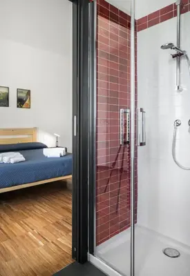 a bathroom with a shower and a bed at Cozy flat 2 bedrooms 2 bathrooms with balcony in Rome