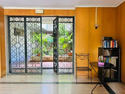 a room with a glass door with a table at San Peter loft in Rome