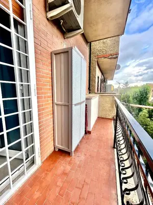 a balcony with a door on the side of a building at San Peter loft in Rome