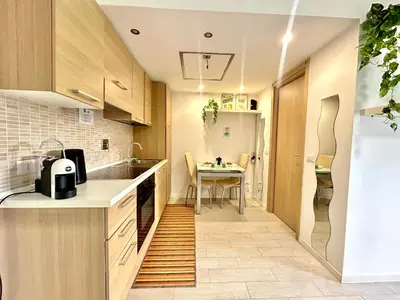 a small kitchen with a table and a dining room at San Peter loft in Rome