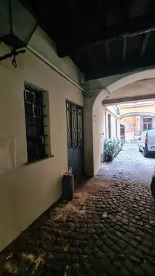 an alley with a car parked in a building at Hybris Campo De' Fiori in Rome