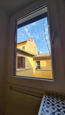 a door with a window with a view of a building at Hybris Campo De' Fiori in Rome