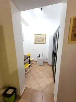 a white bathroom with a sink and a shower at TEVERONE in Rome
