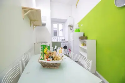 a kitchen with a table with a basket on it at Vatican Apartment - Sister's Place in Rome