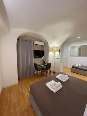 a bedroom with a bed with two towels on it at Elian Apartament In The Center of Rome #2 in Rome