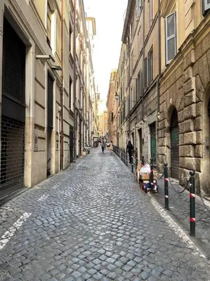 a cobblestone street in a city with buildings at Elian Apartament In The Center of Rome #2 in Rome