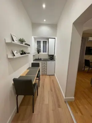 a kitchen with a table and chairs in a room at Elian Apartament In The Center of Rome #2 in Rome