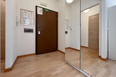 a glass door in a room with a hallway at La Casa di Roma in Rome
