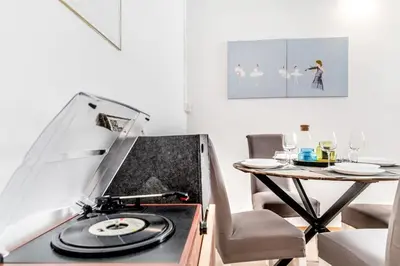 a kitchen with a record player and a table at Vatican Blue Sky in Rome